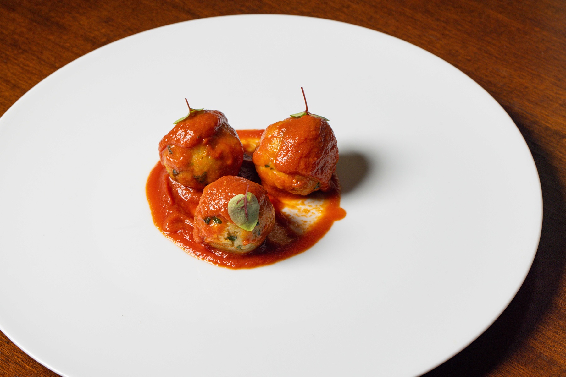 Trentino: Canederli (bread dumplings) with tomato sauce