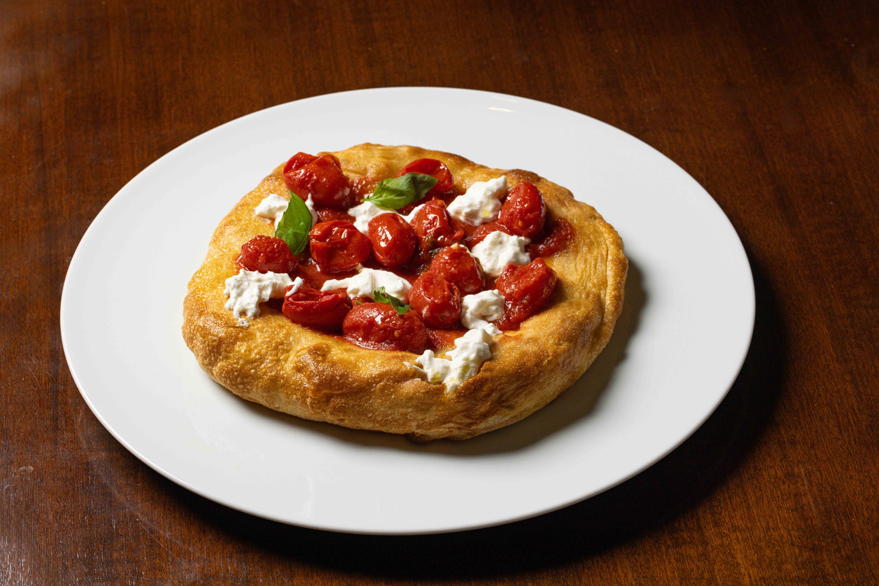 Puglia: Focaccia barese (from Bari) with canned datterini (or cherry) tomatoes, burrata and basil pesto