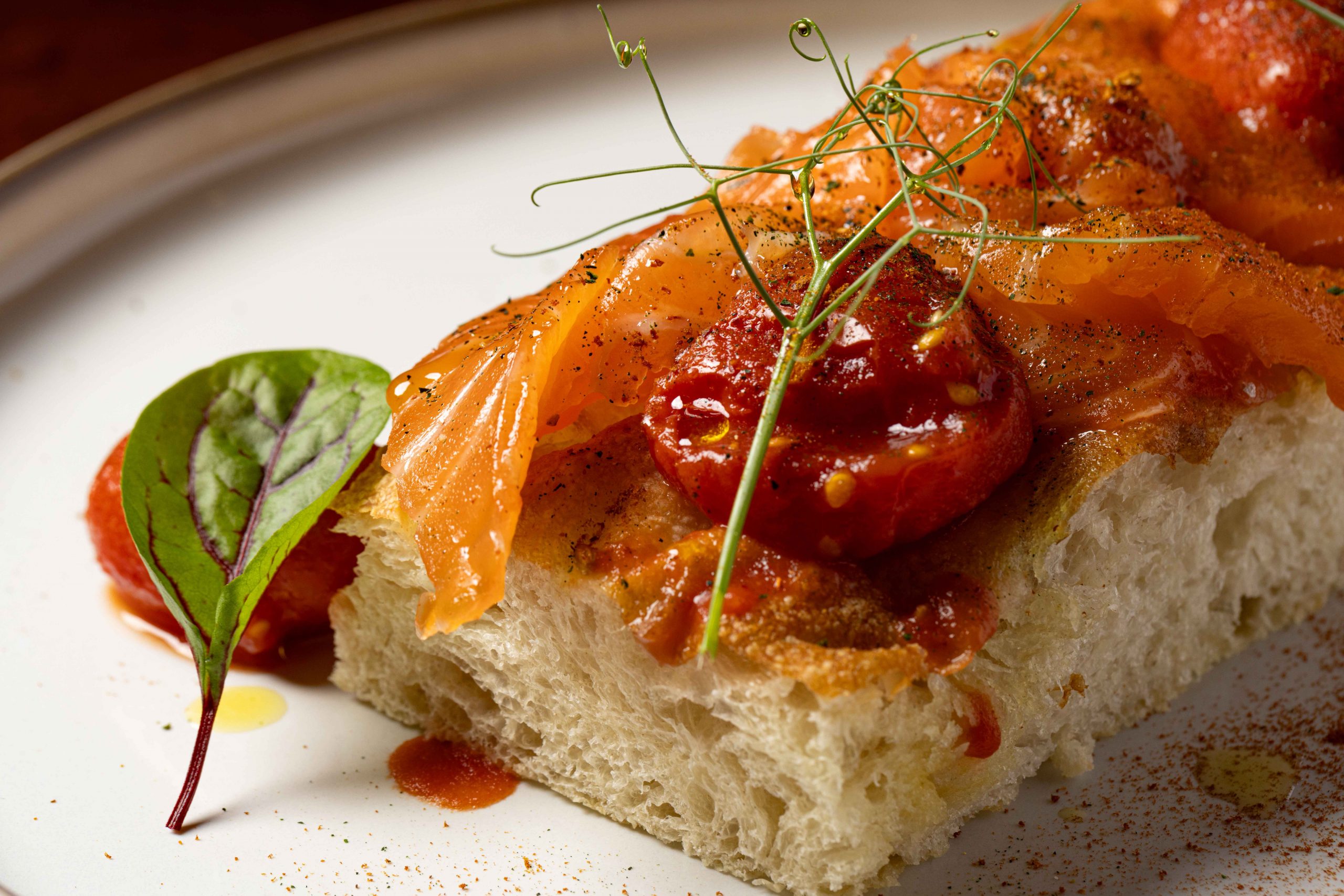 Swedish-style salmon (gravlax), organic datterini cherry tomatoes and basil focaccia